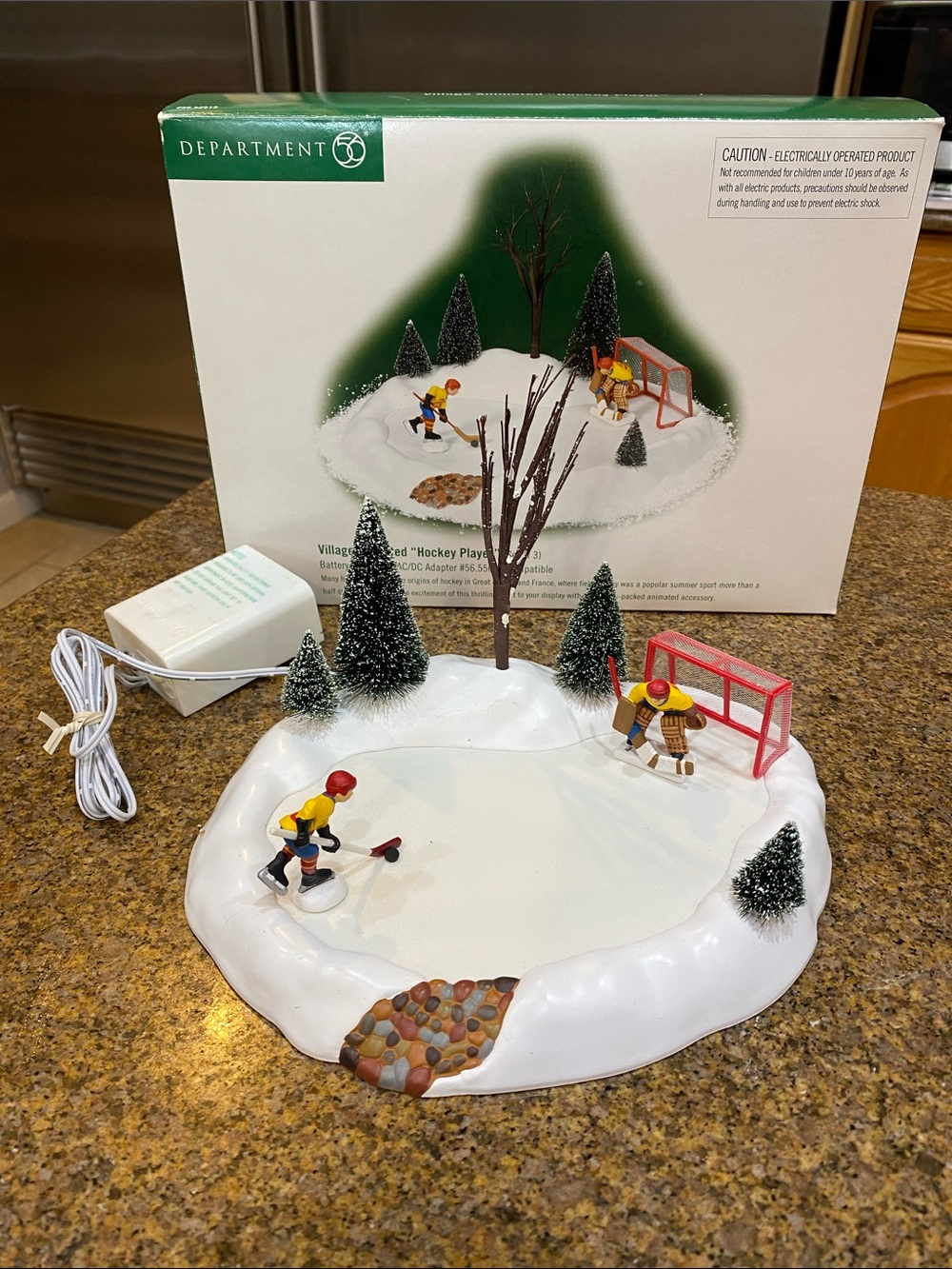 Department 56 Village Animated Hockey Player.